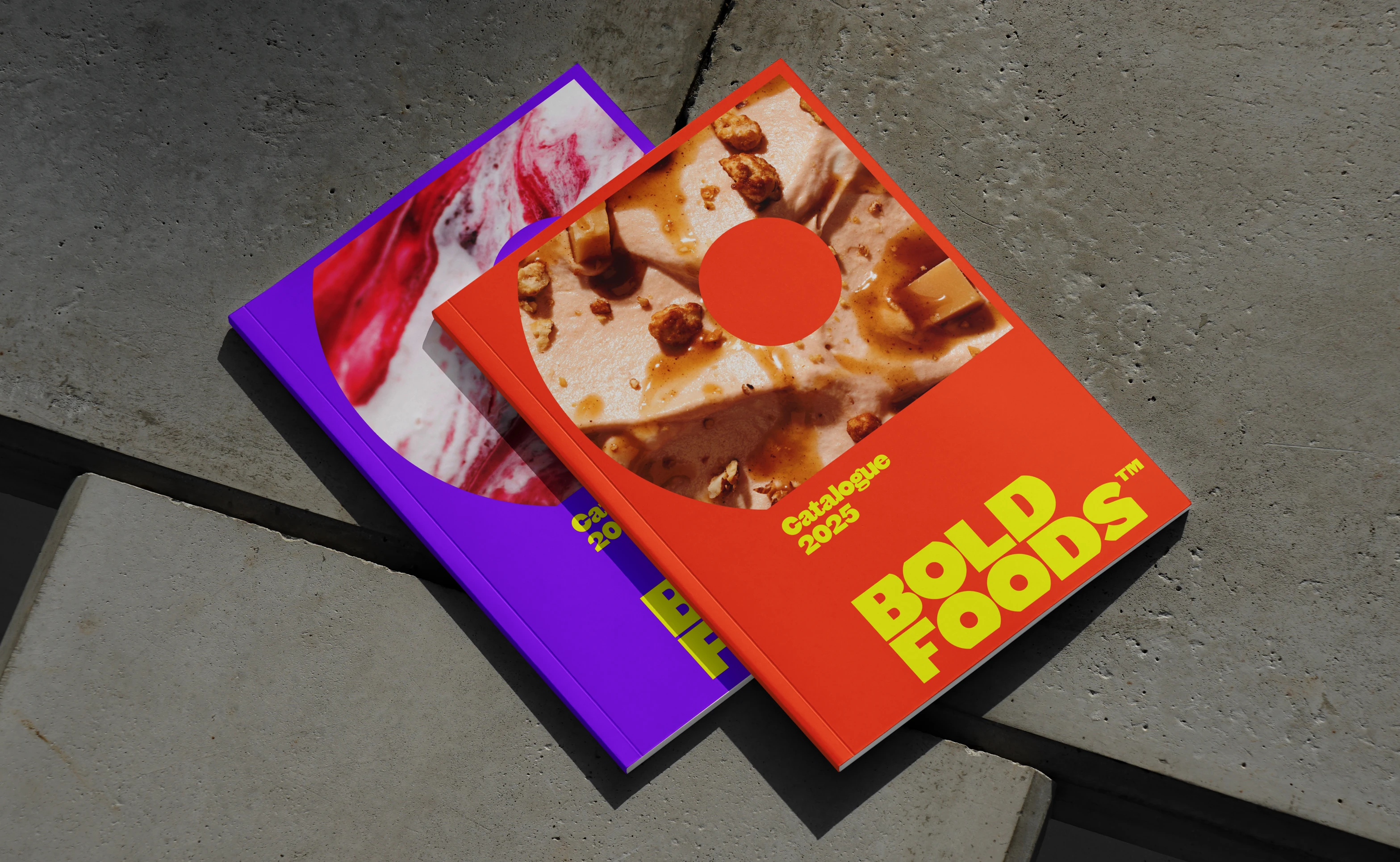 Image of two Bold Foods catalogues on a concrete background